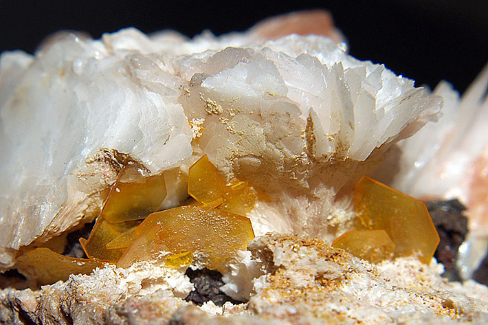 Very thin yellow crystals of wulfenite on white baryte from Mibladen, Morocco