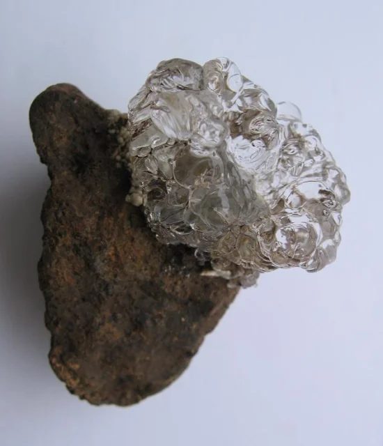 Mineral photo of Opal (var. hyalite) from locality Valeč, Czech Republic