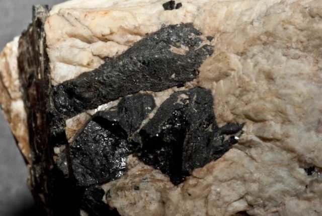 Mineral photo of Rutile (var. strüverite) from locality Údraž, Czech Republic