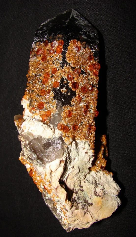 Mineral photo of Quartz (var. smoky), Spessartine from locality Tongbei, China