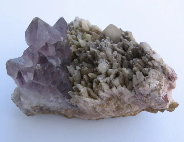 Mineral photo of Calcite, Quartz (var. amethyst) from locality Doubravice, Czech Republic