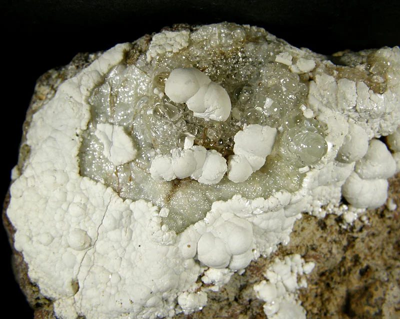 Mineral photo of Fluorapatite, Opal (var. hyalite) from locality Valeč, Czech Republic