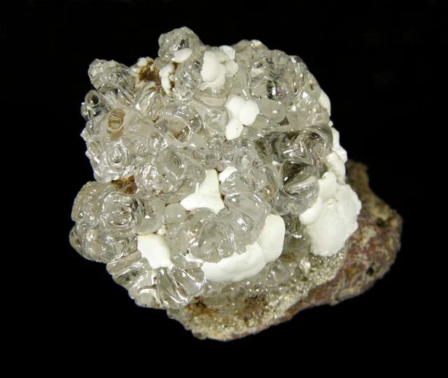 Mineral photo of Fluorapatite, Opal (var. hyalite) from locality Valeč, Czech Republic