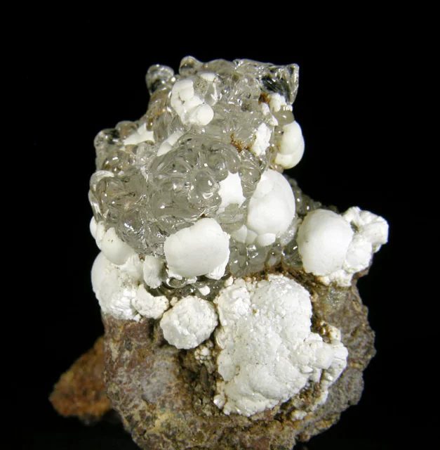 Mineral photo of Fluorapatite, Opal (var. hyalite) from locality Valeč, Czech Republic