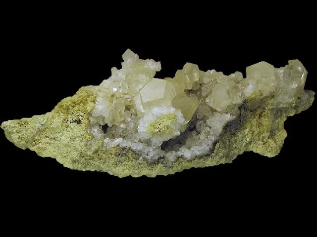 Mineral photo of Calcite, Quartz (var. rock crystal) from locality Krty, Czech Republic