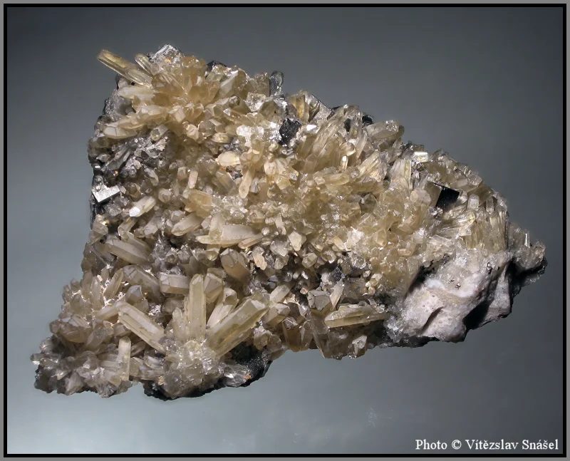 Mineral photo of Pyrite, Quartz (var. smoky) from locality Cavnic, Romania