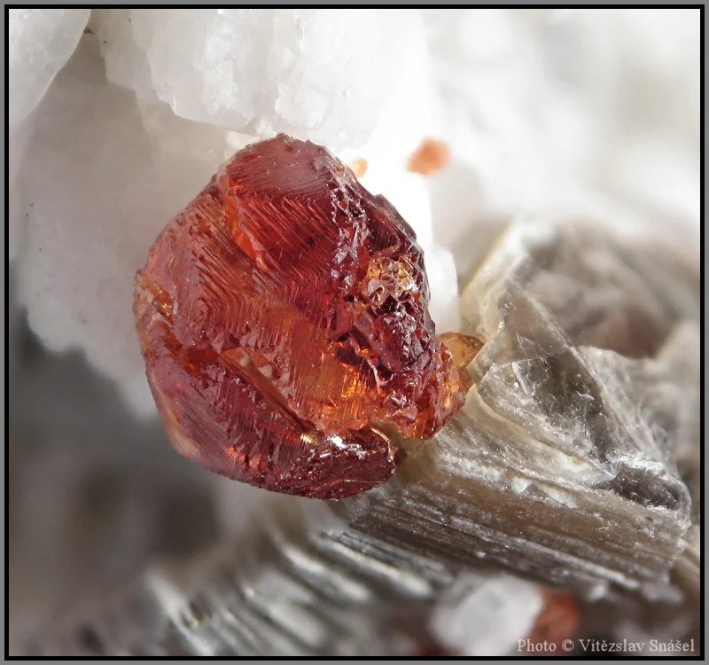 Mineral photo of Muscovite, Spessartine from locality Malkhan, Russia