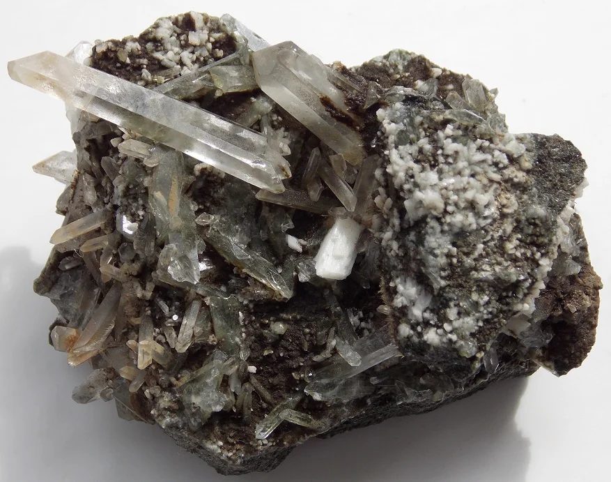 Mineral photo of Laumontite, Quartz (var. rock crystal) from locality Markovice, Czech Republic
