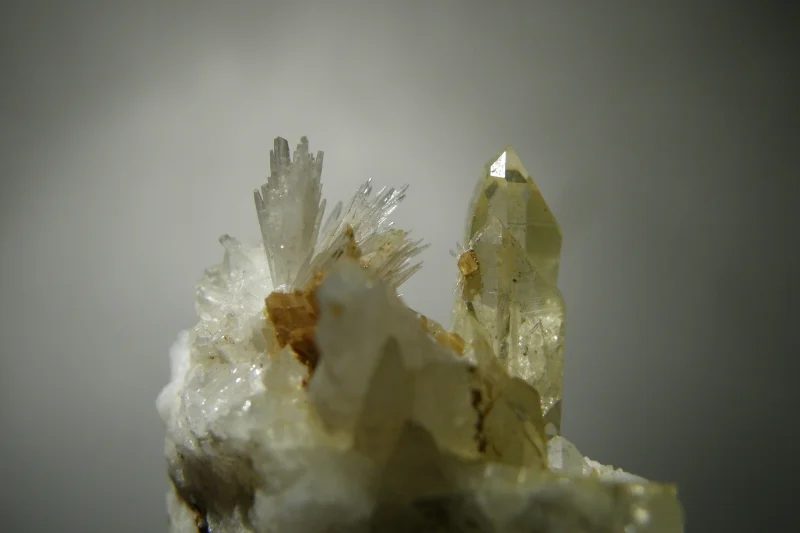 Mineral photo of Aragonite, Magnesite, Quartz (var. rock crystal) from locality Dosso dei Cristalli, Italy