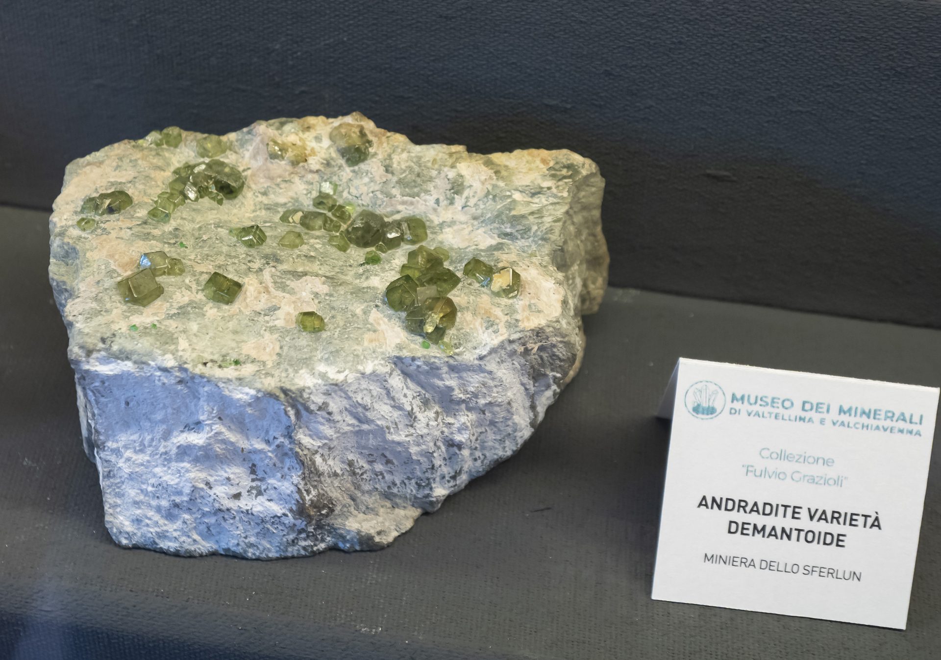 Mineral photo of Andradite (var. demantoid) from locality Sferlùn asbestos mine, Lanzada, Sondrio Province, Lombardy, Italy